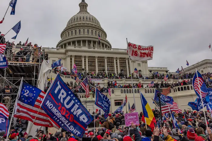 Trump supporters pack the area in front of the US Capitol building, some holding banner in support of Donald Trump